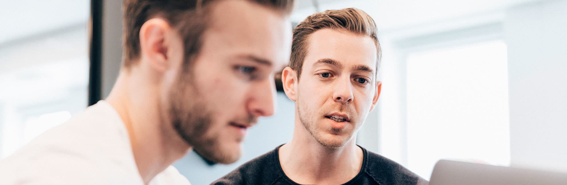 Two men discussing performance management