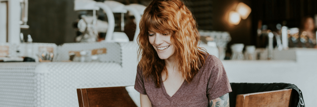 Red headed woman engaged in e-learning