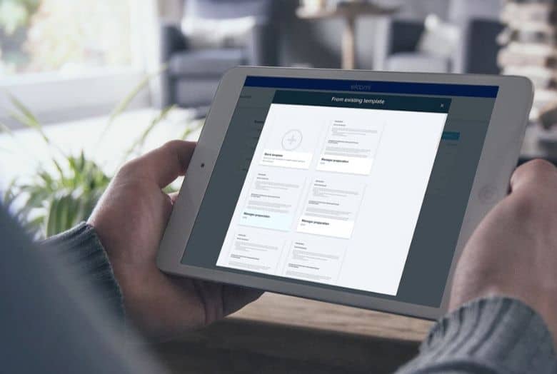 manager looking at a manager template on a tablet