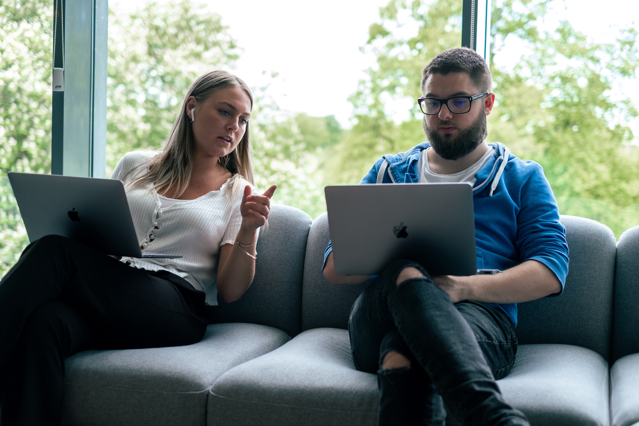 two colleagues working in a open office space